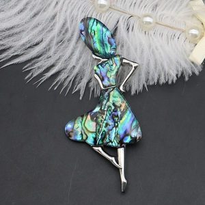 Detail of ballet dancer brooch featuring iridescent abalone shell on silver alloy base