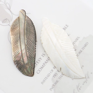 Carved shell feather pendants in black and white mother of pearl for DIY jewelry making