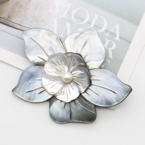 Dual-use mother of pearl flower brooch and necklace pendant with centered white pearl