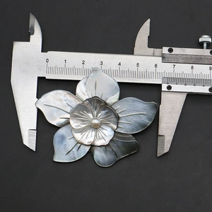 Macro detail of the 6.5cm double-layer flower brooch pendant crafted from grey shell