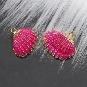 Detail of pink shell charms with gold plating edges for DIY jewelry making