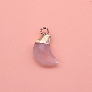 Detailed view of faceted pink quartz crescent moon pendant with rose gold plated loop