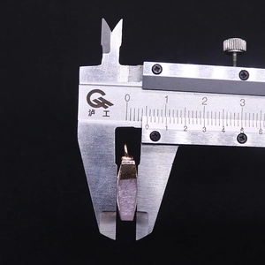 Macro view of 8mm pink natural stone pillar pendant measured with a caliper