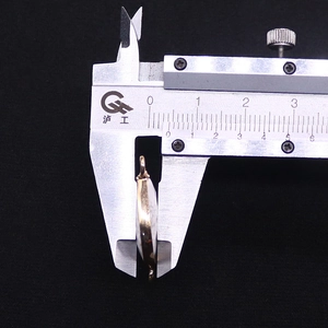 Macro view of 6mm thickness measurement for faceted strawberry crystal pendant with gold edge