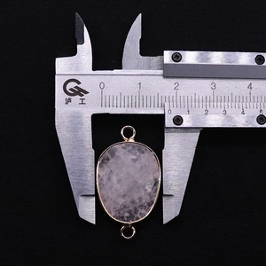 Detailed macro view showing the 16mm width of the faceted pink natural stone connector