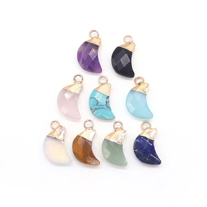 Collection of nine natural semi-precious stone moon pendants with gold plated metal loops