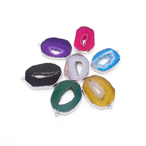Set of seven colorful natural agate slice pendants with silver-plated edges and metal loops