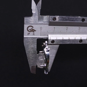 Detail view showing 8.5mm thickness measurement of natural stone dolphin pendant
