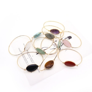 Gold-plated open bangles featuring irregular oval natural stone settings for women