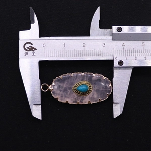 Detailed measurement of oval natural stone pendant with blue teardrop center stone