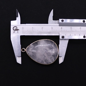 Detailed measurement of teardrop natural stone pendant showing width of 3.8 cm with gold trim