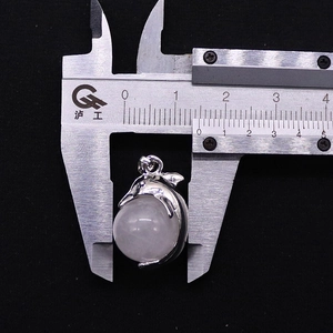 Measuring a dolphin-shaped pendant with an 18mm pink crystal quartz round bead