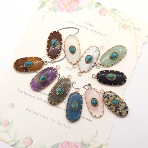 Set of 10 vintage oval stone pendants with turquoise inlay and gold filigree edges