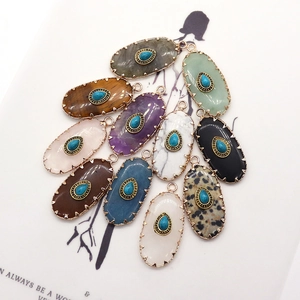 Oval natural stone pendants with turquoise accent and gold sawtooth edge bohemian style
