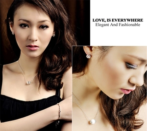 Elegant cat eye stone pendant necklace set with silver earrings and a delicate bracelet