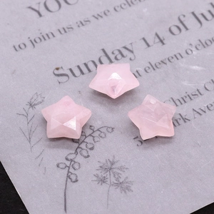 Detailed view of pink rose quartz star-shaped faceted gemstone beads for DIY jewelry