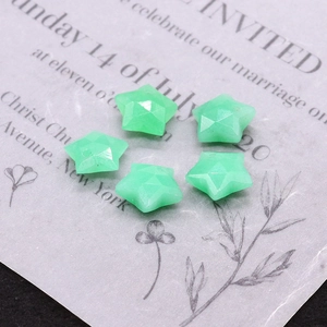 Detail view of five faceted star-shaped light green natural stone pendants for DIY jewelry