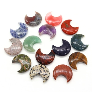 Crescent moon shaped natural healing stones including tiger eye and amethyst set