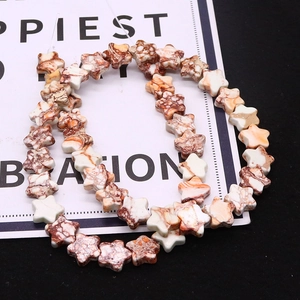 Close-up of star-shaped marble texture natural stone beads for DIY jewelry making