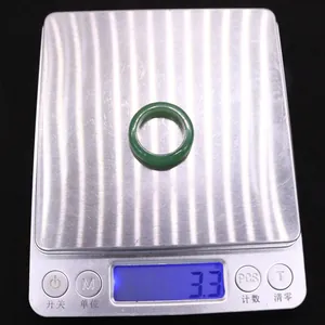 Detailed view of 3.3g green agate ring on digital scale showing precise weight measurement