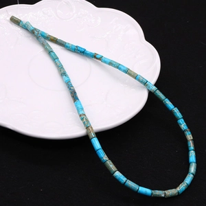 Macro shot of sky blue imperial jasper cylinder beads for jewelry making