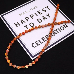 Close-up of red and orange faceted imperial stone beads for DIY jewelry making