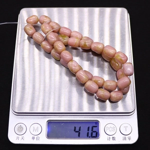 Pink emperor stone tube beads for DIY jewelry making weighing 41.6g on a digital scale