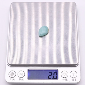 Faceted teardrop Amazonite stone pendant weighing 2.0g on a digital scale