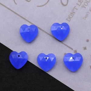 Macro shot of 5 faceted heart-shaped blue-purple stone pendants for DIY jewelry making