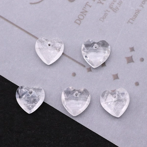 Macro shot of clear heart-shaped faceted crystal beads for DIY jewelry making