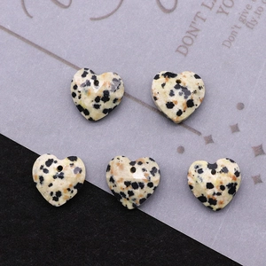 Macro shot of 13mm faceted heart-shaped spotted natural stone beads for DIY jewelry