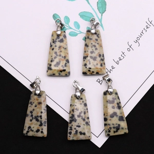 Polished trapezoid Dalmatian Jasper stone pendants with silver bails on a decorative card