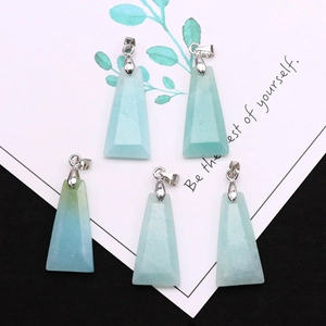 Macro detail of five trapezoid natural blue amazonite stone pendants with silver clasps