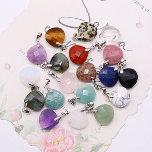 Faceted heart-shaped gemstone pendants in diverse natural stones with silver metal bails
