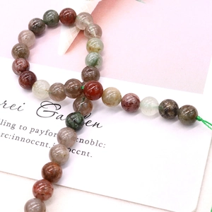 Perles rondes en quartz rutilé naturel pour la création de bijoux sur carte blanche