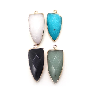 Set of four natural stone shield pendants with gold plating and faceted quartz texture