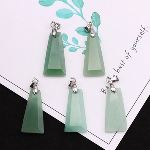 Close-up of five trapezoid green natural stone pendants with silver metal clasps