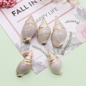 Set of five natural shell turbo pendants with gold plated edges and metal hanging rings
