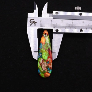 Macro shot of 14mm width measurement for teardrop natural stone pendant using calipers