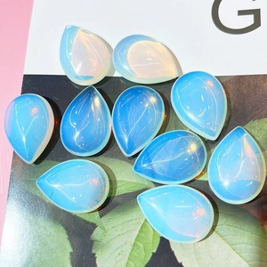 Macro shot of polished opalite pear-shaped teardrop beads for DIY jewelry making