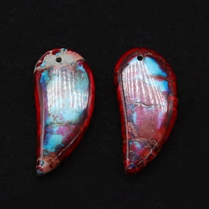 Macro view of colorful polished crescent natural stone pendants for DIY necklace jewelry
