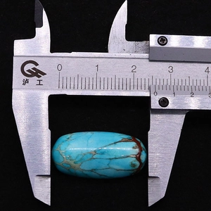 Measuring 12x25mm turquoise imperial stone oval cabochon with detailed red veining