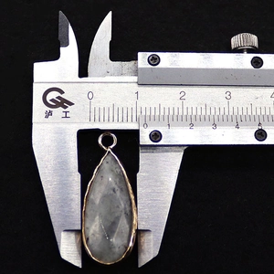 Detailed measurement of teardrop agate pendant width using a professional caliper tool