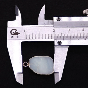Detailed measurement of a moonstone pendant with gold frame showing 21mm width size