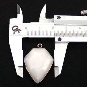 Detailed caliper measurement showing the 22mm width of the natural stone pendant