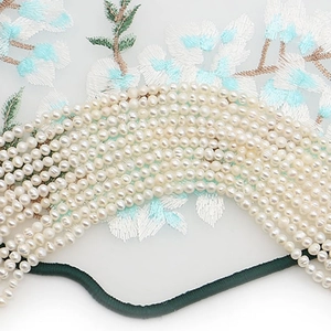 Natural white freshwater pearls for DIY jewelry making with elegant floral embroidery