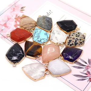 Shield-shaped natural stone pendants with faceted cut and gold plated metal edges
