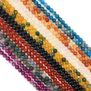 Detailed macro view of colorful natural stone round beads for DIY jewelry making