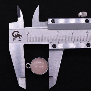 Detailed measurement of 13mm round pink quartz gemstone pendant with silver bail using caliper
