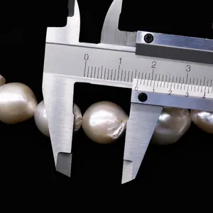 Detailed measurement of a 15mm white baroque freshwater pearl with natural texture